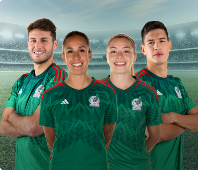 Picture of four soccer players from the Mexican National Team, wearing the official jersey while smiling and looking at the camera. The two on the sides are males and have their arms crossed while the two in the middle are female and have their arms behind their backs. 